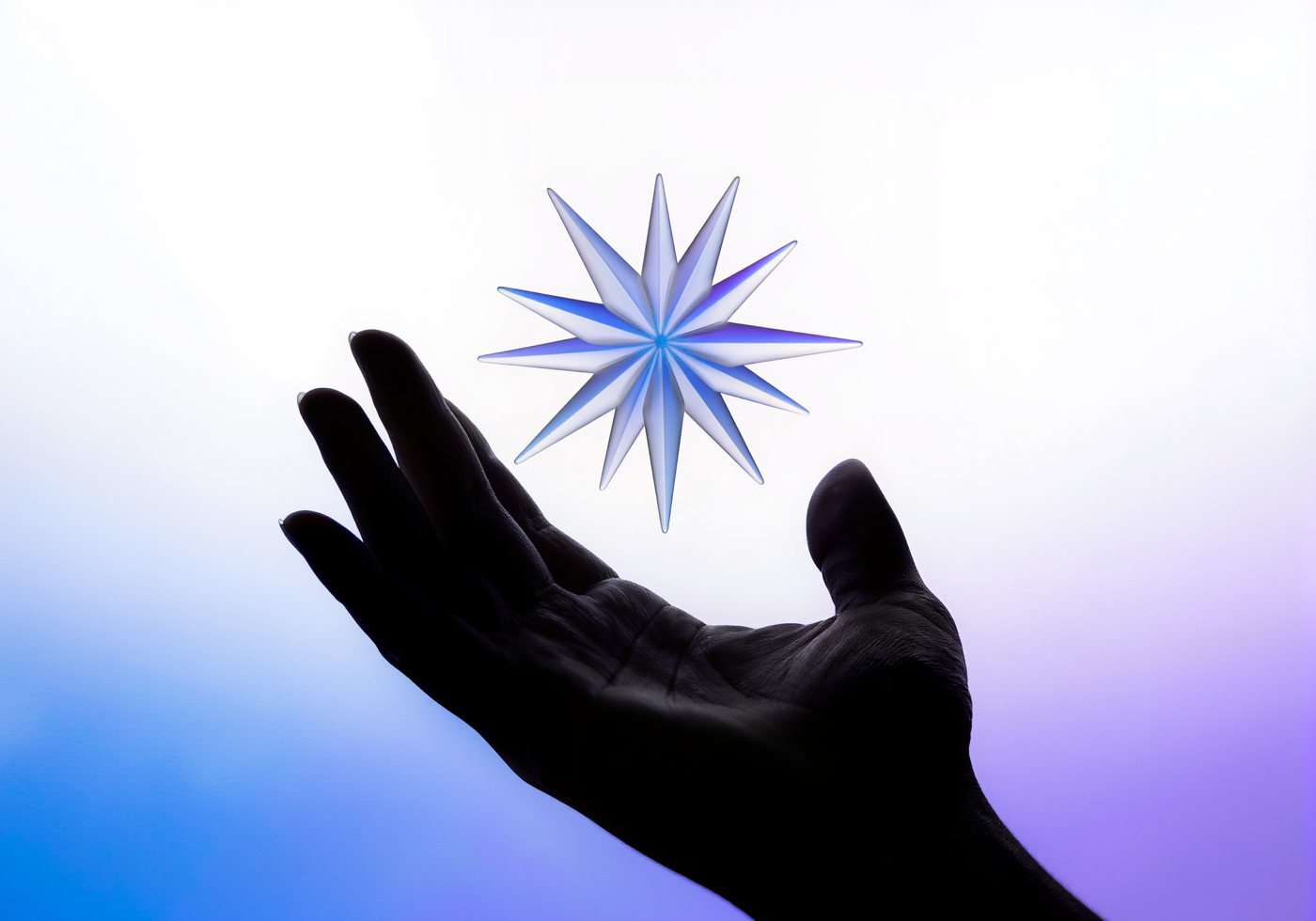 An open hand with a glass starburst hovering above it